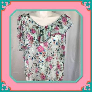 Flirty feminine sheer floral top with ruffles